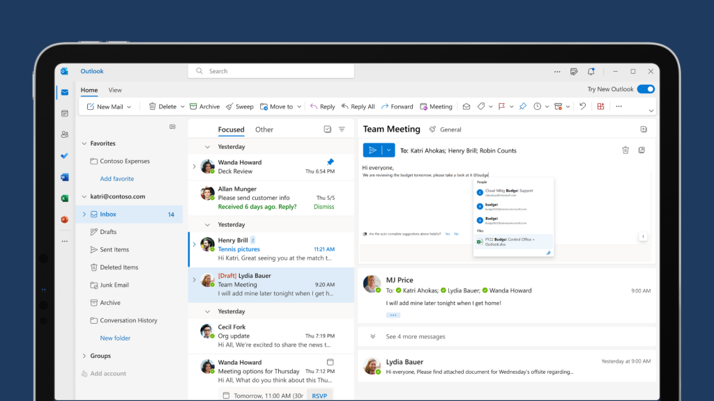 The Microsoft Outlook interface shows an email inbox. The user is drafting up an email to reply to an email chain. This is shown inside the top half of a laptop screem.